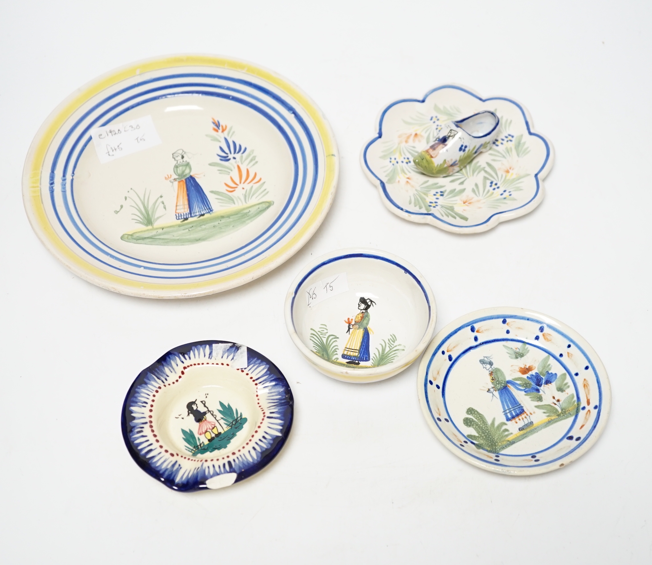 A group of Quimper pottery and a Quimper Pottery book by Angela Meadows